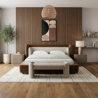 Como upholstered wingback bed in cognac and off-white in a bedroom with a wood-slat accent wall, fluted nightstands and a boucle bench at the foot of the bed
